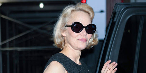 Pamela Anderson was seen wearing black Garrett Leight Mr. Leight Portia S ML2053 BK-GM/BLUOPL Limited Edition oval sunglasses with blue lenses in New York City, May 2025. Shop online now on Pretavoir