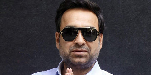 Bollywood actor Pankaj Tripathi was seen wearing black and gold Versace Medusa Charm 2199 1002/81 Polarised sunglasses. Shop online now on Pretavoir