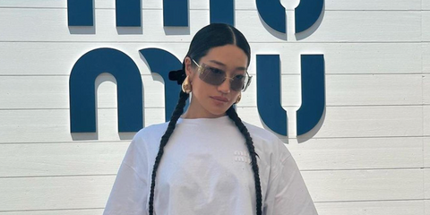 International DJ Peggy Gou was seen wearing gold Miu Miu Rimless Runway MU 54YS 5AK30B sunglasses with grey lenses at the Miu Miu Summer Club during 2023 Cannes Film Festival