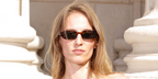 Photographer Petra Collins was seen wearing tortoiseshell Saint Laurent Sun SL 872 Erin 004 sunglasses with grey lenses at the Saint Laurent Menswear Spring/Summer 2027 fashion show during Paris Men's Fashion Week.