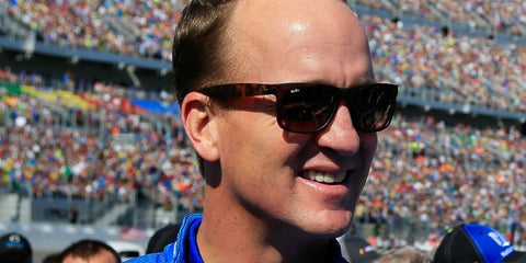 Former American football quarterback Peyton Manning was seen wearing havana tortoiseshell Ray-Ban Justin 4165 71013 sunglasses at the 60th annual DAYTONA 500 in 2018.
