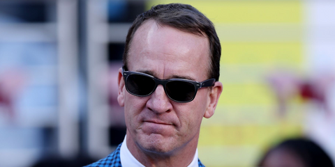 Former American football quarterback Peyton Manning was seen wearing brushed gunmetal and transparent Ray-Ban New Wayfarer 2132 614371 sunglasses at the Super Bowl LX in San Francisco, February 2026.