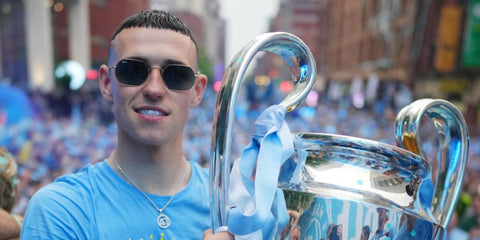 Phil Foden was seen wearing gunmetal Ray-Ban Octagonal RB 3556N 004/71 sunglasses with grey gradient lenses to celebrate Manchester City's Champions League victory in 2023