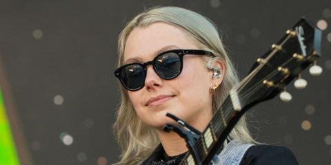 Singer-songwriter Phoebe Bridgers was seen wearing black Oliver Peoples Cary Grant Sun OV5413SU 1492/3R sunglasses with blue Polarised lenses on stage at the 2022 Forecastle Festival in Louisville, Kentucky. Shop online now on Pretavoir
