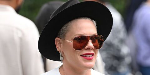 P!nk was seen wearing rose gold Gucci GG1436S 003 sunglasses with red monogram lenses at the 2024 Wimbledon Championship