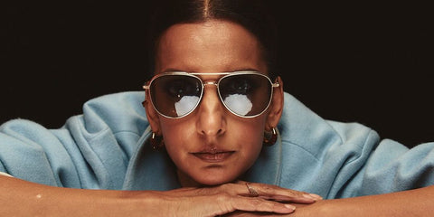 Actress Poorna Jagannathan was seen wearing gold Oliver Peoples Rivetti OV1335ST 5035/R5 sunglasses with grey lenses in a The Hollywood Reporter feature, January 2025. Shop online now on Pretavoir