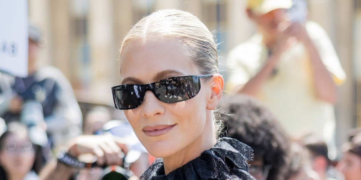 Poppy Delevingne was seen wearing black Saint Laurent Sun SL 807 002 shield sunglasses at the Elie Saab Haute Couture Fall/Winter 2026 fashion show during Paris Couture Week.