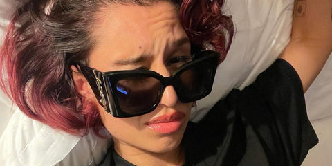 RAYE was seen wearing Saint Laurent Sun Blaze SL M119 001 sunglasses in her X Twitter post