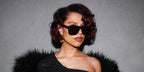 RAYE was seen wearing black Saint Laurent Sun SL 558 003 oversized sunglasses in her Facebook post