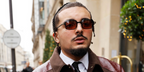 French rapper RK (Ryad Kartoum) was seen wearing black Cartier CT0539S 003 sunglasses with brown lenses during Paris Men's Fashion Week Fall/Winter 2026