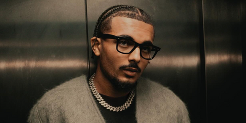 French rapper RK (Ryad Kartoum) was seen wearing black Ray-Ban Wayfarer Ease RB 4340V 2000 optical glasses in his Instagram post, September 2025.