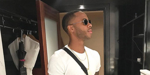 English footballer Raheem Sterling was seen wearing gold Ray-Ban Octagonal RB 3556N 001 sunglasses in 2018. Shop online now on Pretavoir