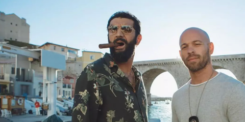 French actor Ramzy Bedia was seen wearing gold Ray-Ban Cockpit 3362 001/51 sunglasses with brown gradient lenses in 2018 action/comedy movie "Taxi 5". Shop online now on Pretavoir