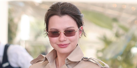 Thai actress Rebecca Patricia Armstrong was seen wearing gold Miu Miu MU B50S 5AK20I sunglasses with light brown lenses at Hotel Martinez, during Cannes Film Festival 2026.