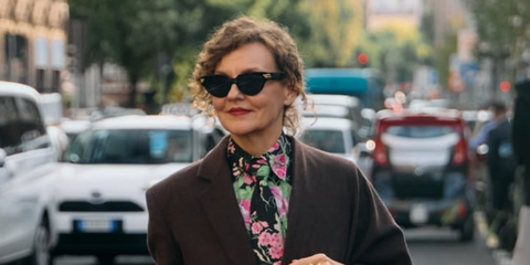 Fashion influencer Renia Jaz was seen wearing black Bottega Veneta BV1035S 001  round cat eye sunglasses at the Moschino Spring/Summer 2026 fashion show during Milan Fashion Week. Shop online now on Pretavoir