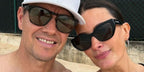 Model Rhea Durham, pictured with husband Mark Wahlberg, was seen wearing black Prada PR A09S 1AB5S0 sunglasses. Shop online now on Pretavoir
