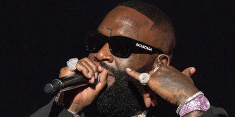 Rapper Rick Ross was seen wearing black Balenciaga BB0262SA 001 square sunglasses while performing onstage at Rick Ross: Port Of Miami Orchestra Reunion Tour in Atlanta, Georgia, June 2026.