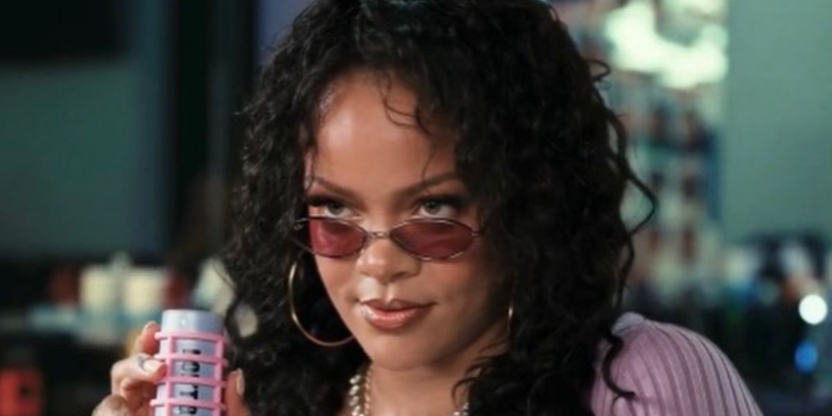 Rihanna was seen wearing gunmetal Ray-Ban Kai RB 3757 004/69 oval sunglasses with purple pink lenses in Fenty Skin's "DON'T BE DUMB. USE SPF" campaign, released July 2026.