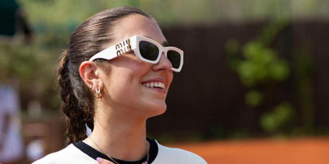 Dua Lipa's sister Rina Lipa was seen wearing white Miu Miu MU 09WS 1425S0 sunglasses at the Miu Miu Tennis Club.