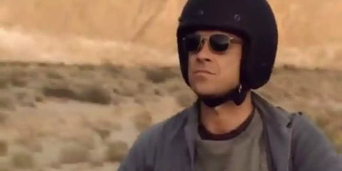 Robbie Williams is seen wearing the iconic American Optical Original Pilot C1 BT CL GNG-P Gold 23K Polarised sunglasses in his music video 'Bodies'