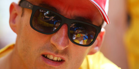 Polish racing driver Robert Kubica was seen wearing rubber black Ray-Ban Justin RB 4165 622/T3 Polarised sunglasses ahead of the 24 Hours of Le Mans, June 2025. Shop online now on Pretavoir