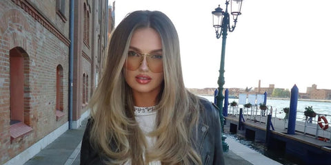 Romee Strijd is seen wearing gold Bottega Veneta BV1065S 005 sunglasses with yellow lenses in her Instagram account