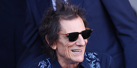 Rock musician Ronnie Wood of The Rolling Stones was seen wearing black and gold Versace 4447 GB1/87 sunglasses at the La Liga EA Sports match between FC Barcelona and Real Madrid FC in October 2023.