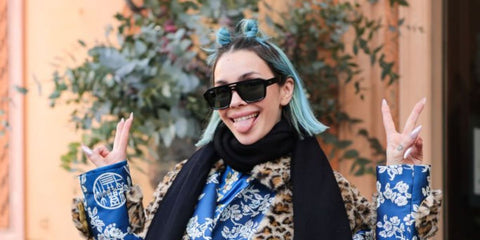 Rose Villain was seen wearing black Ray-Ban Corrigan RB 4397 6677/71 square aviator sunglasses with dark green lenses to attend the 2024 Sanremo Music Festival