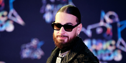 French rapper SCH was seen wearing black Prada PR 02ZS 1AB06T sunglasses with grey gradient lenses at the 24th edition of the NRJ Music Awards in Cannes.