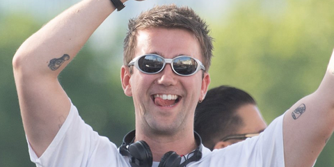 Music producer SG Lewis was seen wearing grey silver Oakley Eye Jacket Redux OO9438 05 Prizm Polarised sunglasses at the Labyrinth On The Thames, August 2026.