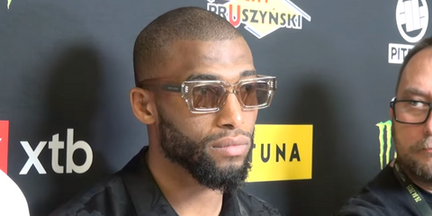 French mixed martial artist Salah-Dine Parnasse was seen wearing transparent Saint Laurent Sun SL 572 003 sunglasses at a press conference for a KSW (Konfrontacja Sztuk Walki) fight promotion in Poland, April 2025.
