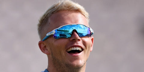 Cricketer Sam Curran was seen wearing white and blue Oakley Radar EV Path OO9208 57 sunglasses.