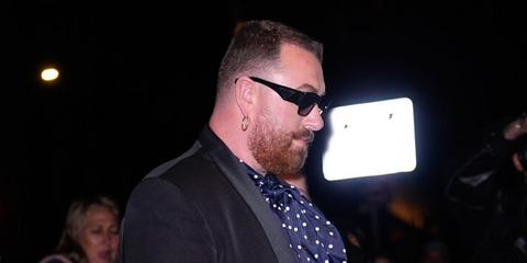 Sam Smith was seen wearing black Prada PR 10ZS 1AB5S0 square sunglasses at Jeff Bezos and Lauren Sanchez's pre-Met Gala party in New York City, May 2026.
