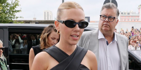 Scarlett Johansson was seen wearing black Prada PR 26ZS 16K08Z oval sunglasses to attend the brand's Spring/Summer 2024 fashion show during Milan Fashion Week