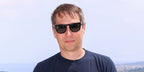 Director Sean Baker was seen wearing black Persol Elio 3333S 95/31 sunglasses at the Cannes Film Festival 2025.