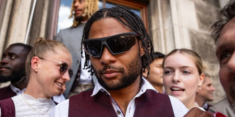 German footballer Serge Gnabry of Bayern Munich F.C. was seen wearing matte black Prada Linea Rossa SPS 07Y DG006F sunglasses in May 2025