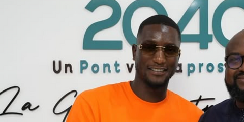 Guinean footballer Serhou Guirassy was seen wearing gold Cartier CT0468S 004 rimless sunglasses with brown gradient lenses at the launch of NGO Africa Niõrondema in July 2025. Shop online now on Pretavoir