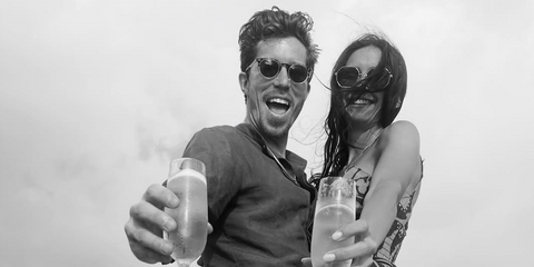 Shaun White (left) is seen wearing Oliver Peoples OP-13 Sun OV5504SU 1754/52 two-tone round sunglasses in his birthday post with wife Nina Dobrev on Instagram