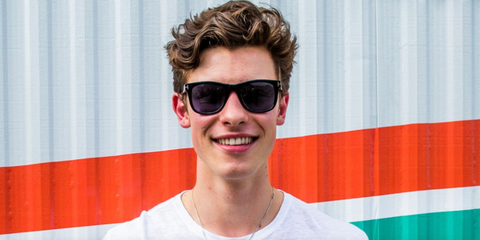 Shawn Mendes was seen wearing black Tom Ford Kevyn TF1099 01N square sunglasses with blue lenses at the Austin City Limits Music Festival