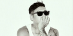Hong Kong actor and singer Shawn Yue was seen wearing black Prada PR B12S 16K731 sunglasses in an Esquire China feature, March 2026.