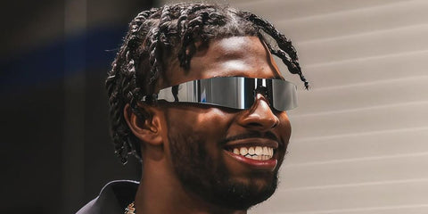 American football quarterback Shedeur Sanders of the Cleveland Browns was seen wearing silver Balenciaga BB0041S 002 shield sunglasses in his Instagram post, August 2025.