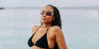 Influencer Sherlina Nym was seen wearing gold Miu Miu Rimless Runway MU 54YS 5AK06I sunglasses with light purple lenses in her Instagram post, August 2025. Shop online now on Pretavoir