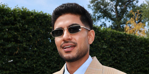 Indian cricketer Shubman Gill was seen wearing gold Prada PR B54S 5AK50P rectangular sunglasses at the Wimbledon Tennis Championships 2026.