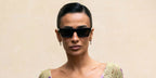 Brazilian influencer Silvia Braz was seen wearing black Saint Laurent Sun SL 461 Betty 001 sunglasses at the Giambattista Valli Spring/Summer 2025 fashion show during Paris Fashion Week