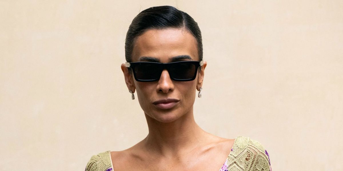 Brazilian influencer Silvia Braz was seen wearing black Saint Laurent Sun SL 461 Betty 001 sunglasses at the Giambattista Valli Spring/Summer 2025 fashion show during Paris Fashion Week