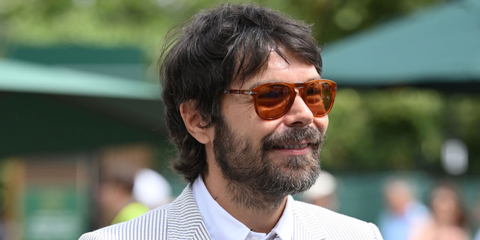 Musician Simon Neil was seen wearing transparent brown Persol Steve Mcqueen 0714SM 96/73 Folding sunglasses with brown lenses at the Wimbledon Tennis Championships 2026.