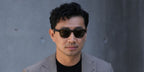 Actor Simu Liu was seen wearing black Giorgio Armani AR8206 6060/1 sunglasses with grey lenses at the Giorgio Armani Menswear Spring/Summer 2026 fashion show during Milan Men's Fashion Week. Shop online now on Pretavoir