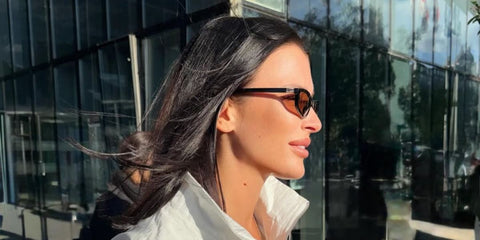 Russian actress and model Sofia Nikitchuk was seen wearing black Miu Miu MU A06S 16K10I sunglasses with brown lenses in Tbilisi, Georgia, shared through her Instagram post in February 2026.