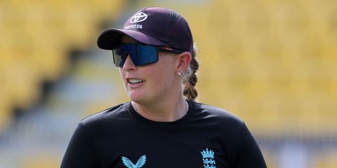 Cricketer Sophie Ecclestone was seen wearing black Prada Linea Rossa SPS A03 1BO10J sunglasses with dark blue to violet lenses during the ICC Women's Cricket World Cup India 2025 match between England and South Africa. Shop online now on Pretavoir