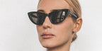 Italian DJ Stella Bossi was seen wearing black Saint Laurent Sun SL 213 001 Lily cat eye sunglasses.